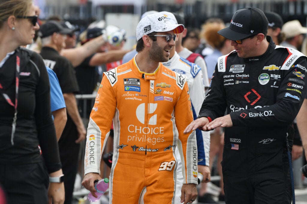 Daniel Suarez (#99 TrackHouse Racing Choice Priviliges Chevrolet) and Kyle Busch (#8 Richard Childress Racing Bank OZK Chevrolet) talk prior to the running of the NASCAR Cup Series Bank of America ROVAL 400 on October 05, 2025, at Charlotte Motor Speedway in Concord, NC.