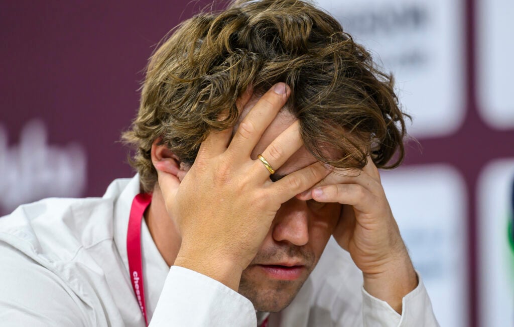 Magnus Carlsen of Norway competes against Sarana Alexey of Russia during the rapid open tenth round of the FIDE World Rapid & Blitz Championship at the Sports and Events Complex, Qatar University.