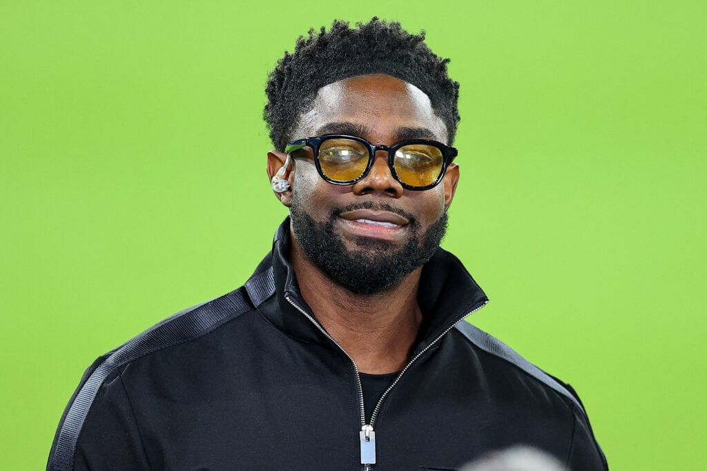 Micah Richards looks on during the UEFA Champions League 2025/26 Round of 16 Second Leg match between Manchester City FC and Real Madrid CF at City of Manchester Stadium.