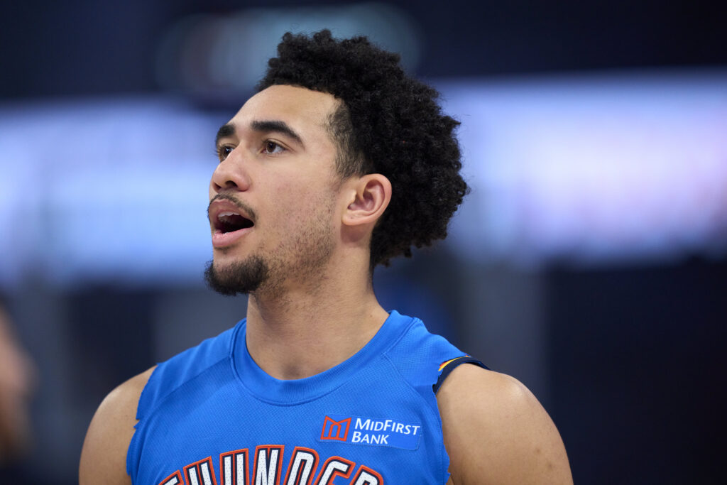 Jared McCain #3 of the Oklahoma City Thunder warms up before tipoff against the Los Angeles Lakers at the Paycom Center.