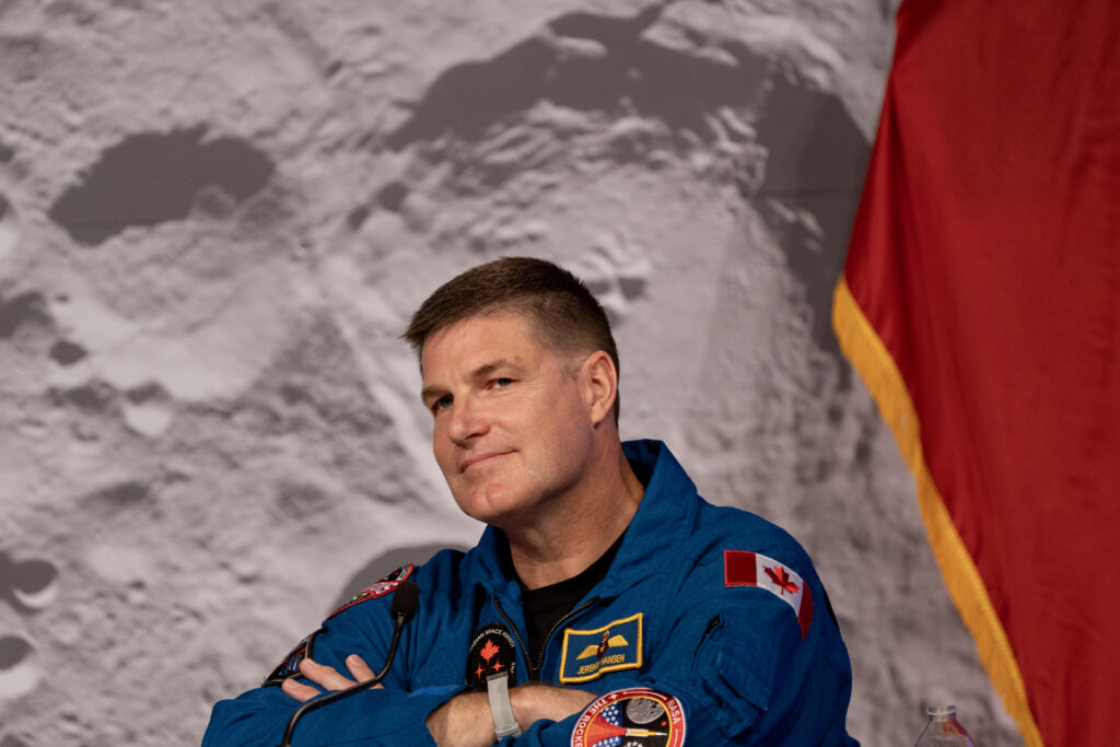 Artemis II Mission Specialist Jeremy Hansen smiles during a press conference at the NASA Johnson Space Center on April 16, 2026 in Houston, Texas. Their historic 10-day mission around the moon concluded successfully nearly one week ago.