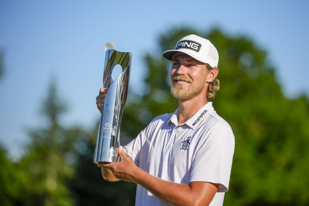 Kristoffer Reitan poses with the trophy after winning the 2026 Truist Championship