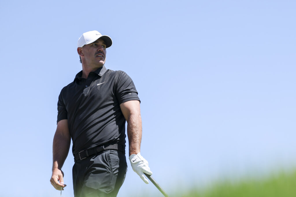 Brooks Koepka watches his tee shot during a practice round ahead of the PGA Championship