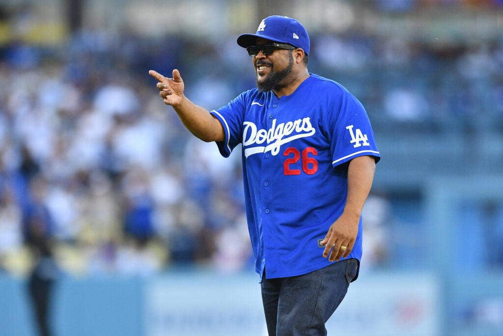 Rapper Ice Cube celebrates after he throws out the first pitch before the MLB game between the San Francisco Giants and the Los Angeles Dodgers on May 12, 2026 at Dodger Stadium.