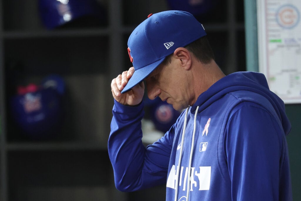 Manager Craig Counsell #11 of the Chicago Cubs walks in the dugout during a game against the Texas Rangers at Globe Life Field.