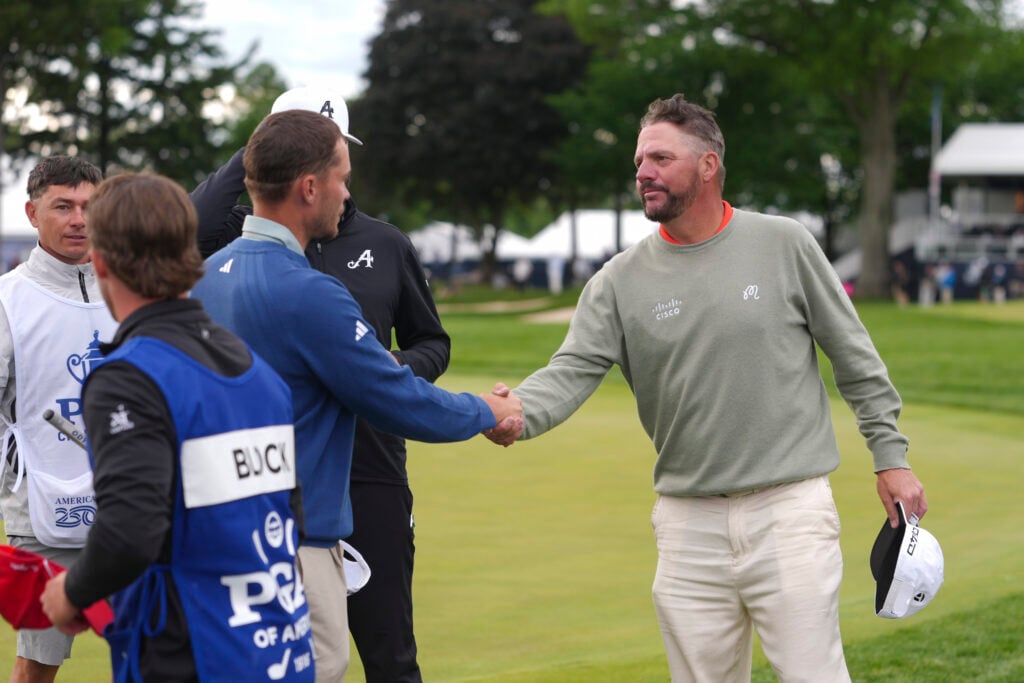 Rasmus Hojgaard and Michael Block shake hands on the ninth hole after their first round of the PGA Championship at Aronimink Golf Club