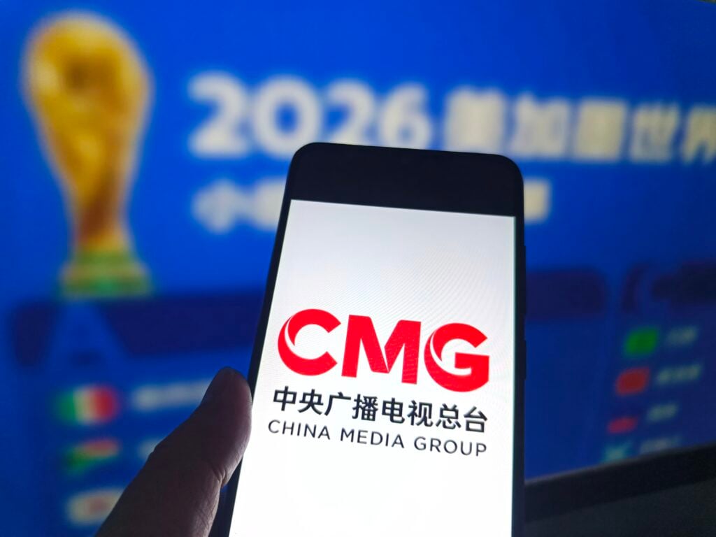 A netizen is checking the CMG logo on his mobile phone.