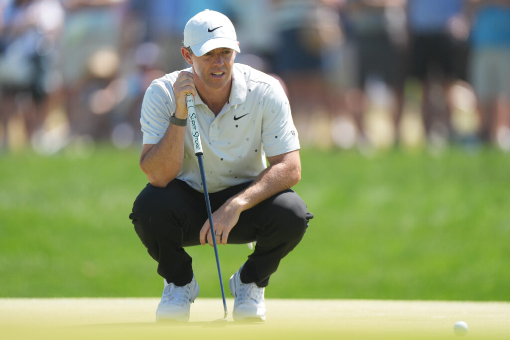 Rory McIlroy of Northern Ireland reads the 16th green during the third round of PGA Championship at Aronimink Golf Club