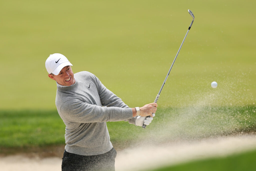 Rory McIlroy hits out of a bunker during a practice round ahead of the PGA Championship