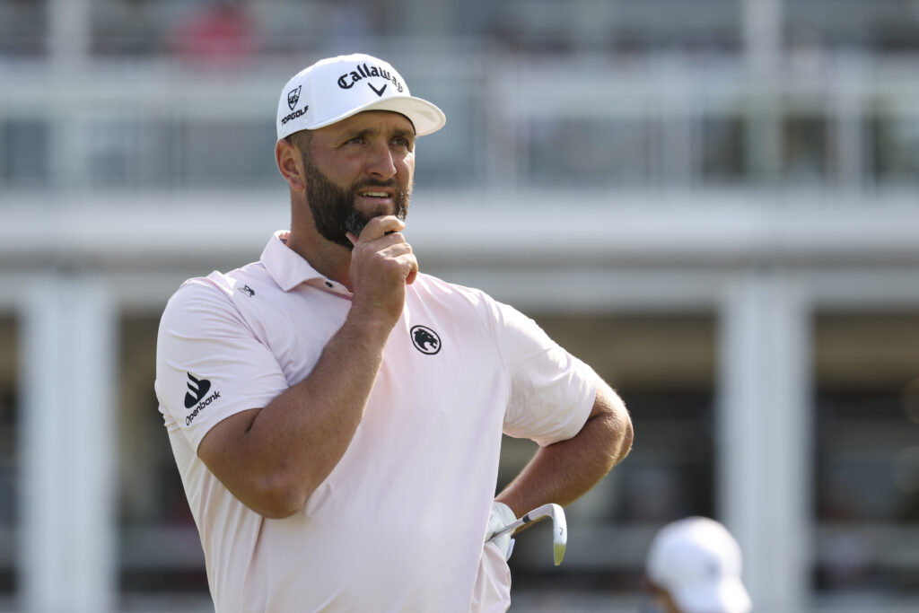Jon Rahm reacts to his tee shot during the third round of the PGA Championship
