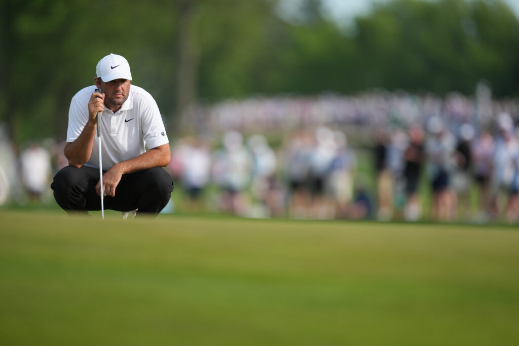Scottie Scheffler lines up a putt during the third round of the PGA Championship