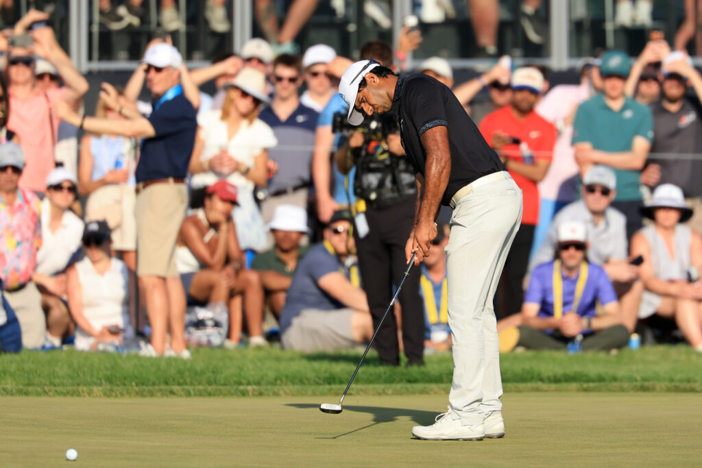 Aaron Rai of England putts on the 17th green during the final round of the PGA Championship at Aronimink Golf Club