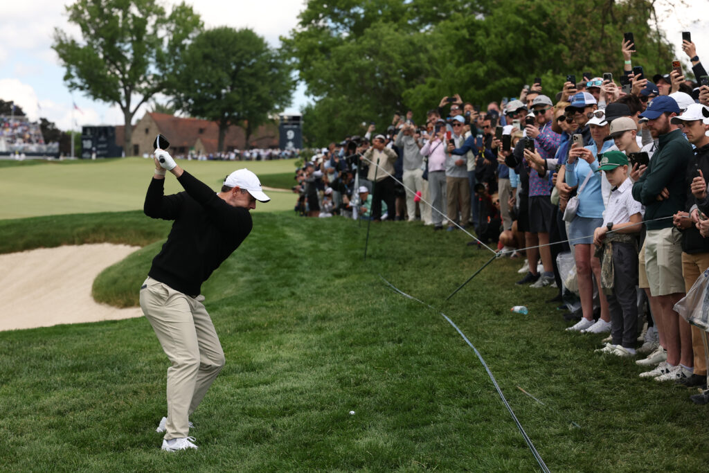 Rory McIlroy of Northern Ireland plays a shot on the ninth hole during the first round of the PGA Championship at Aronimink Golf Club
