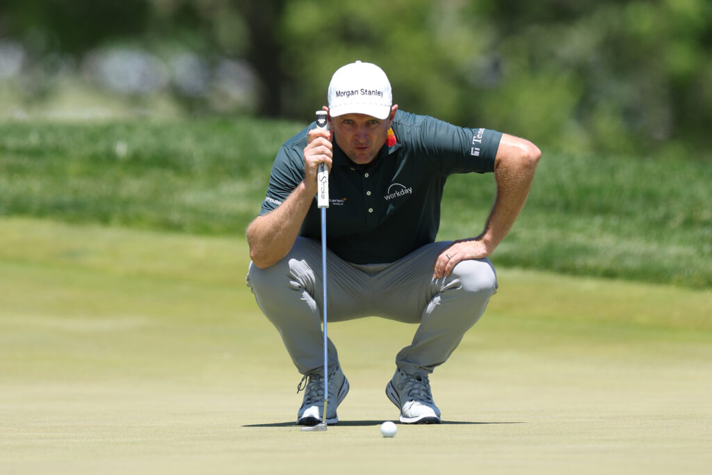 Justin Rose lines up a putt during the third round of the PGA Championship