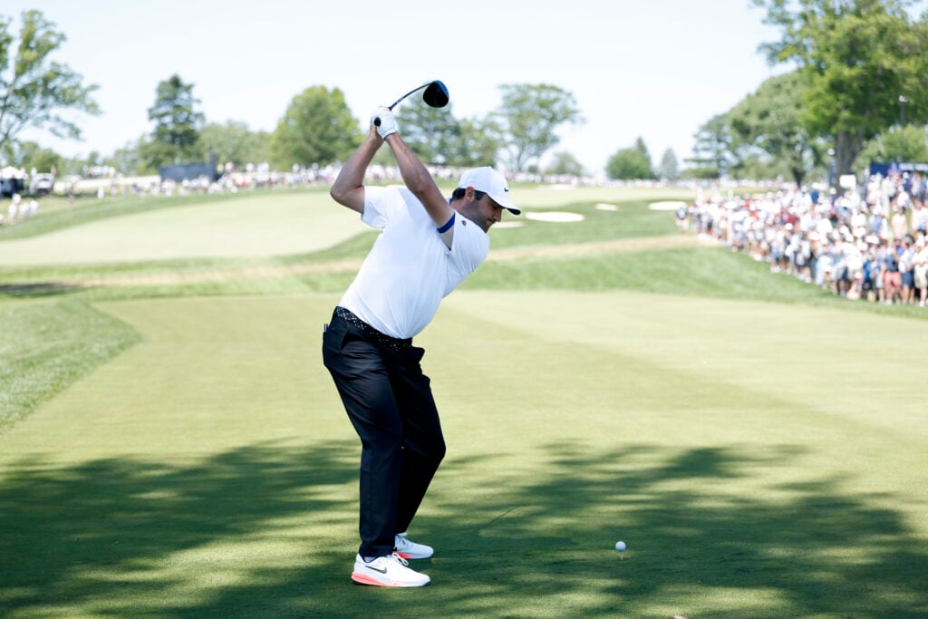 Scottie Scheffler of the United States hits a tee shot during the third round of the PGA Championship at Aronimink