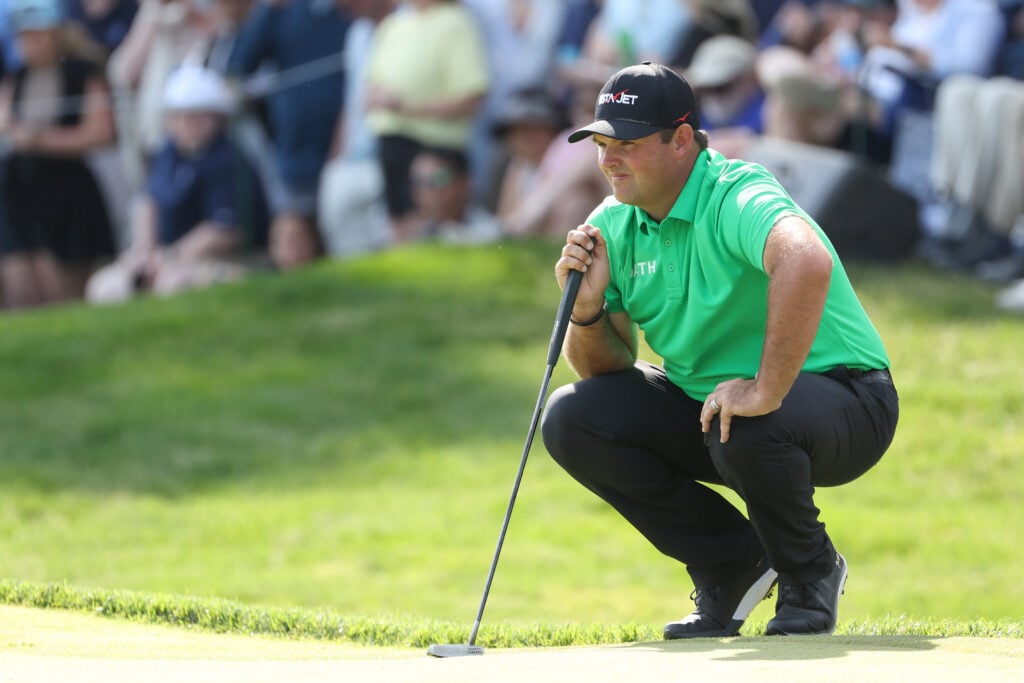 Patrick Reed of the United States looks over a putt on the 18th hole during the third round of the PGA Championship at Aronimink Golf Club