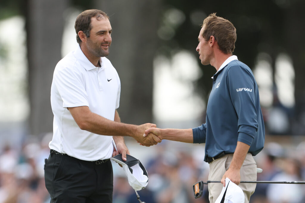 Scottie Scheffler and David Puig shake hands after the third round of the PGA Championship
