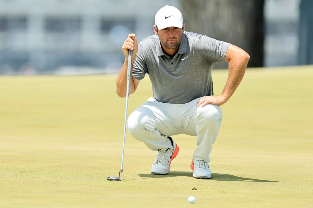 Scottie Scheffler of the United States lines up a putt on the second green during the final round of the PGA Championship at Aronimink Golf Club