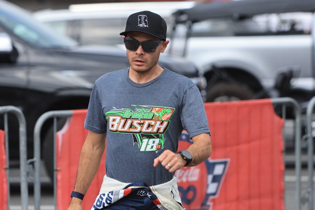 Kyle Larson (#5 Hendrick Motorsports HendrickCars.com Chevrolet) walks in the garage area wearing a Hat honoring the late Kyle Busch and a t-shirt with Brexton Busch's name on it prior to the running of the NASCAR Cup Series Coca-Cola 600 on May 24, 2026 at Charlotte Motor Speedway in Charlotte, NC.