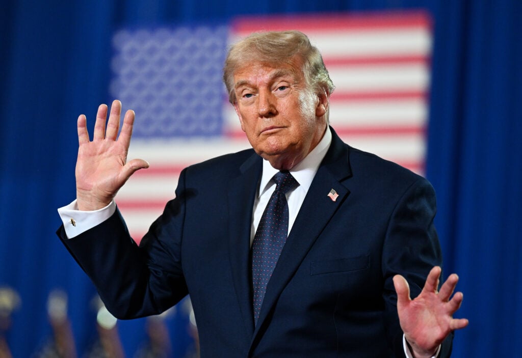 U.S. President Donald Trump dances on stage after delivering remarks during a campaign and economic policy event in the Eugene Levy Fieldhouse at SUNY Rockland Community College.