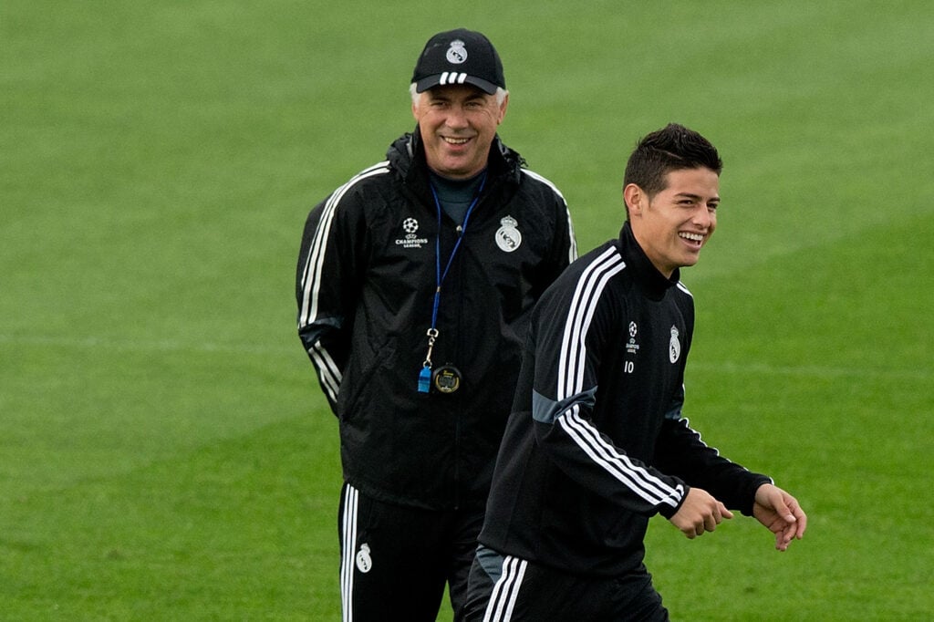 James Rodriguez (R) of Real Madrid CF laughs ahead his head coach Carlo Ancelotti (L) during the training session ahead of the UEFA Champions League Group B match between Real Madrid CF and Liverpool FC at Valdebebas training ground.
