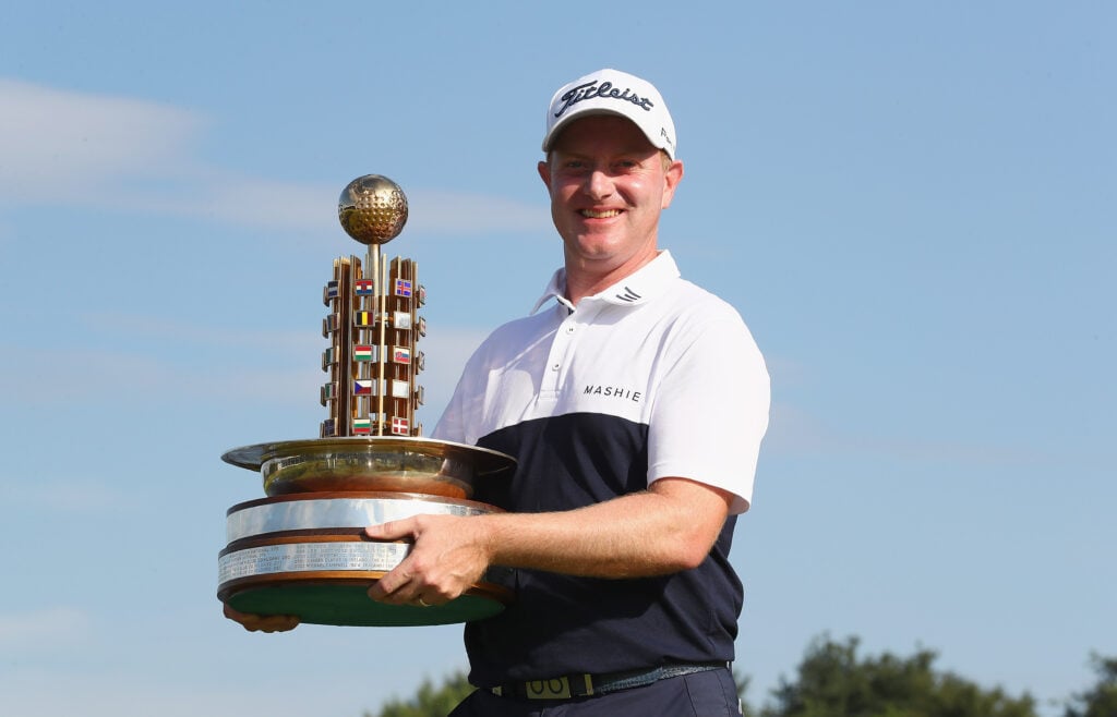 Richard McEvoy holds the trophy after winning the Porsche European Open in 2018