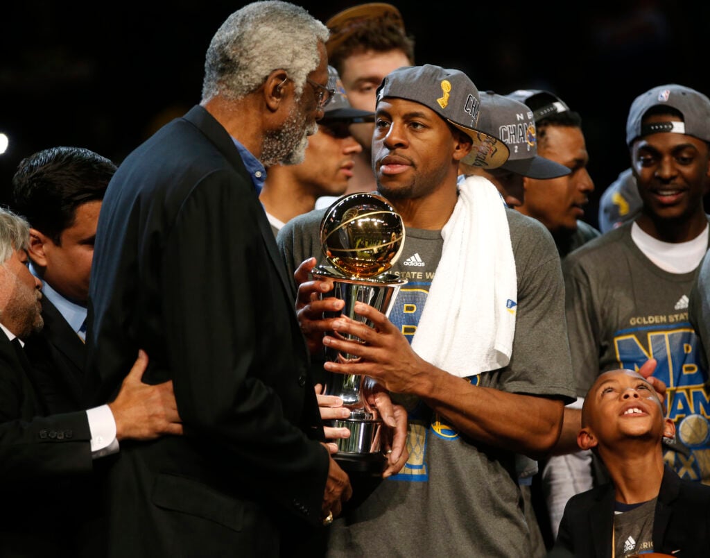 Golden State Warriors' Andre Iguodala (9) receives the MVP trophy from NBA legend Bill Russell after the Golden State Warriors 105-97 win over the Cleveland Cavaliers in Game 6 of the NBA Finals to win the NBA Championship at Quicken Loans Arena in Clevel