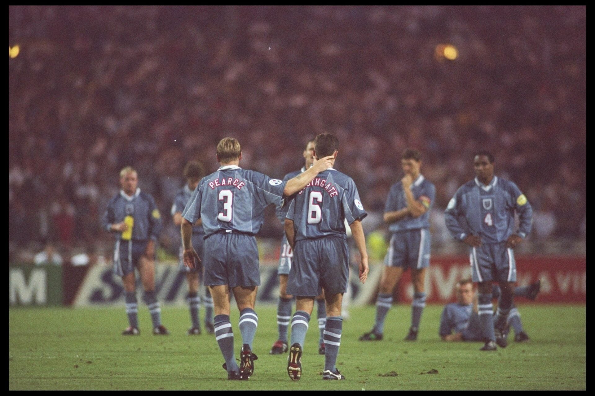 26 Jun 1996: Stuart Pearce (left) consoles teammate Gareth Southgate after his penalty miss during the European soccer championships semi final ma...