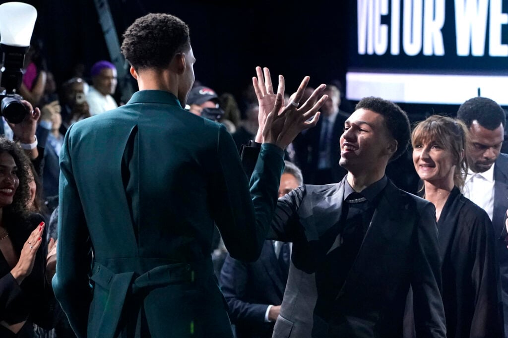 French basketball player Victor Wembanyama (L) celebrates with his brother Oscar after being picked by the San Antonio Spurs during the NBA Draft at Barclays Center.