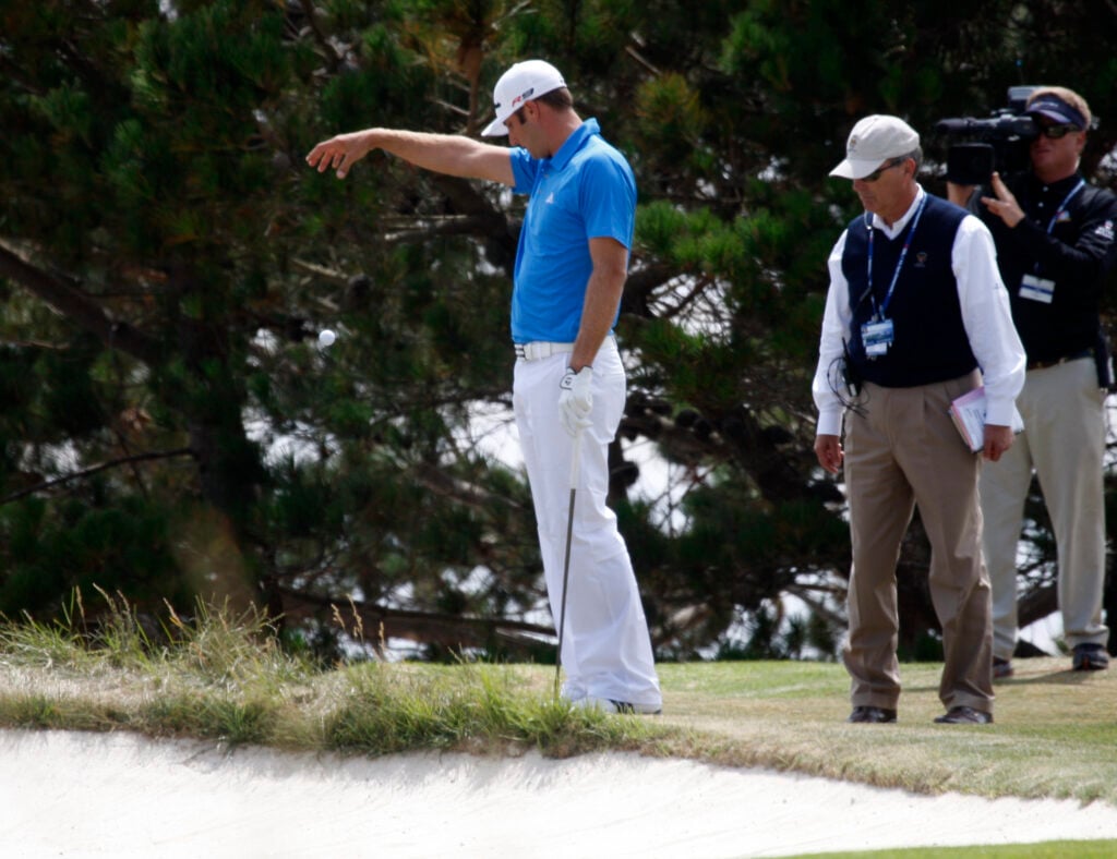 Dustin Johnson takes a drop on the fourth hole during the final round of the 2010 US Open at Pebble Beach