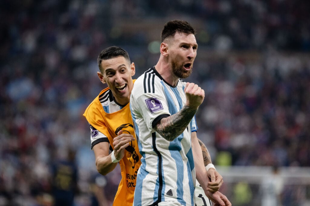 Lionel Messi of Argentina celebrates with Angel Di Maria (L) of Argentina after scoring his team's third goal during the FIFA World Cup Qatar 2022 Final match between Argentina and France at Lusail Stadium.