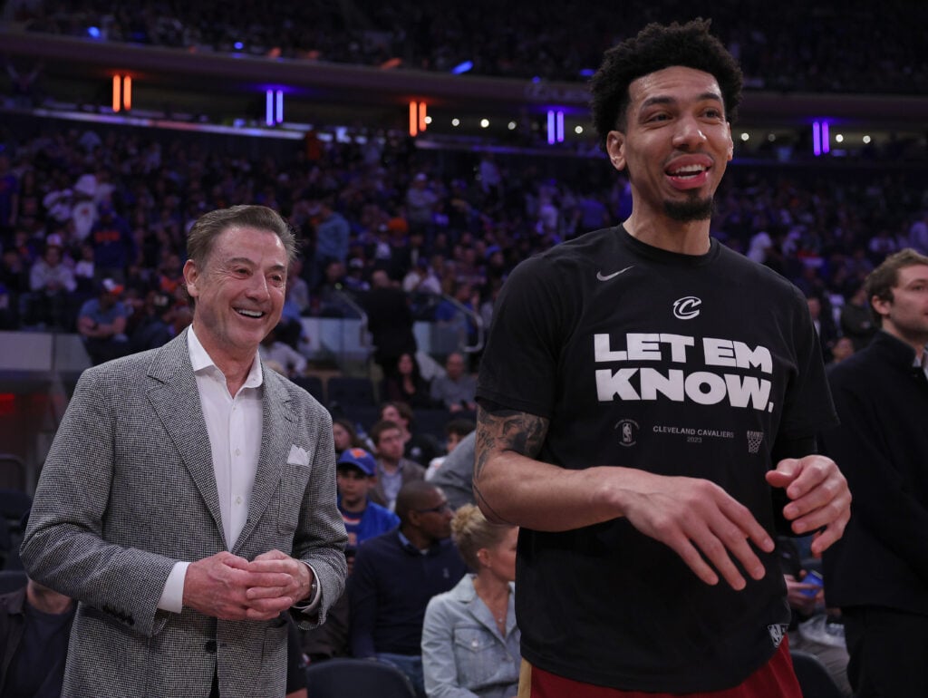 St. John's men's basketball coach Rick Pitino talks with Danny Green #14 of the Cleveland Cavaliers before Game Four of the Eastern Conference First Round Playoffs between the New York Knicks and the Cleveland Cavaliers at Madison Square Garden on April 23, 2023 in New York City.