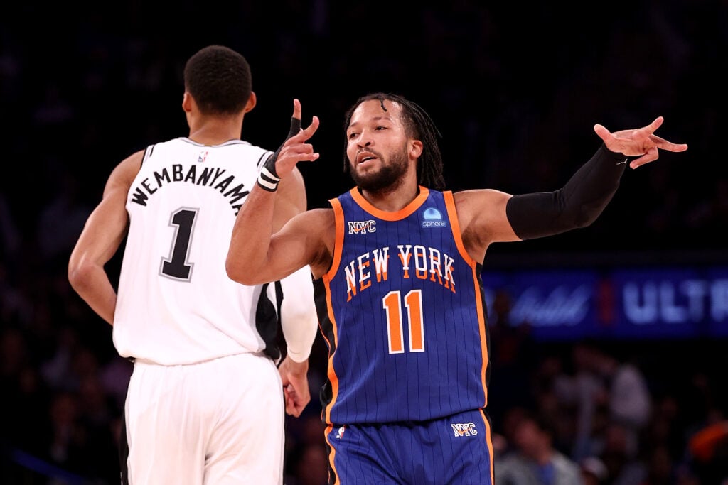 Jalen Brunson #11 of the New York Knicks celebrates his three point basket against Victor Wembanyama #1 of the San Antonio Spurs during the fourth quarter in the game at Madison Square Garden on November 08, 2023 in New York City.