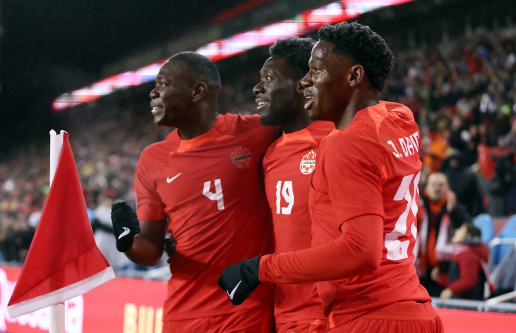 Alphonso Davies and Jonathan David celebrate for Canada