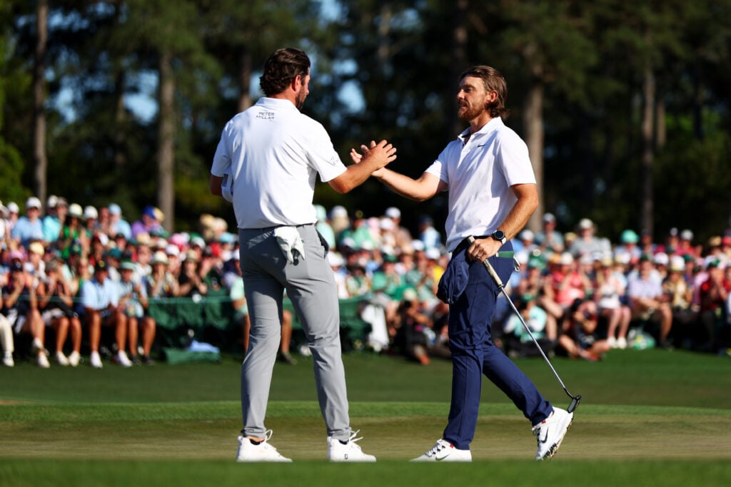 Cameron Young and Tommy Fleetwood on the 18th green after the final round of the 2024 Masters at Augusta National