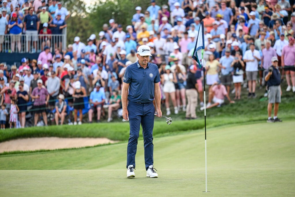 Keegan Bradley reads his putt on the 18th hole during the final round of the BMW Championship