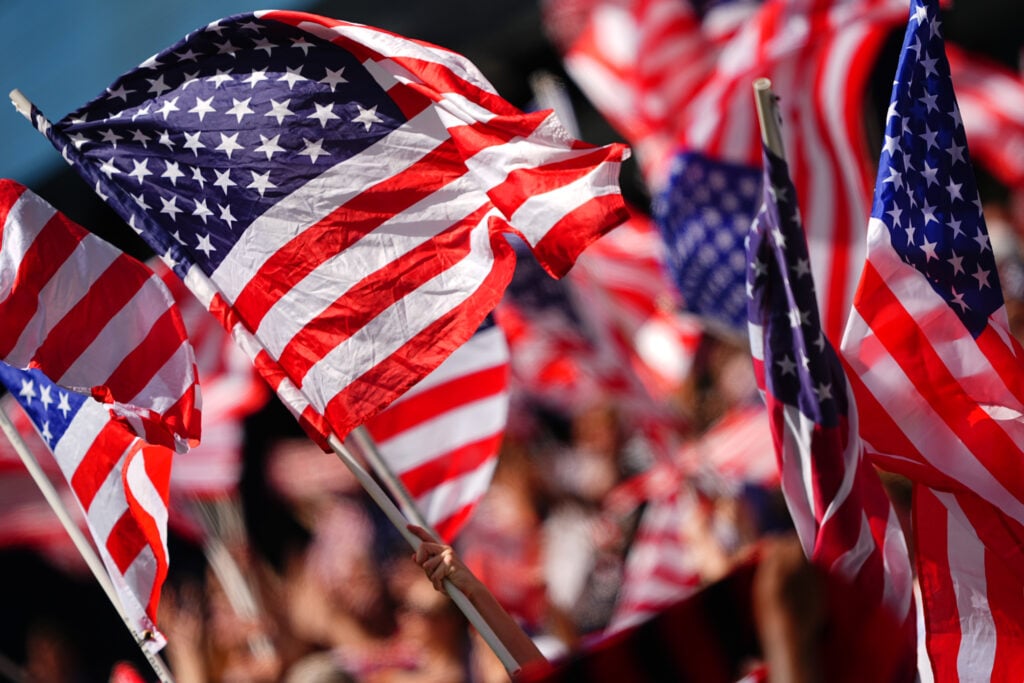 Fans wave flags as USMNT takes on Canada in a Friendly Match at Children's Mercy Park on September 7, 2024 in Kansas City, Kansas.