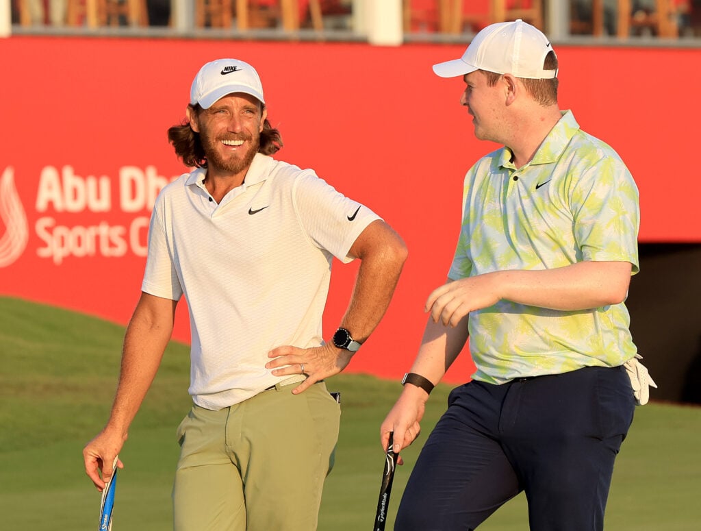 Tommy Fleetwood with Robert MacIntyre of Scotland on the 18th hole during the first round of the Abu Dhabi HSBC Championship