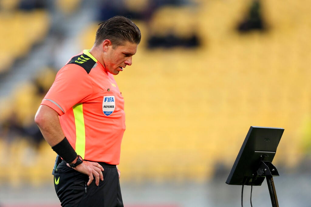 Referee Shaun Evans watches a reply during the round 14 A-League Men match between Wellington Phoenix and Sydney FC at Sky Stadium.