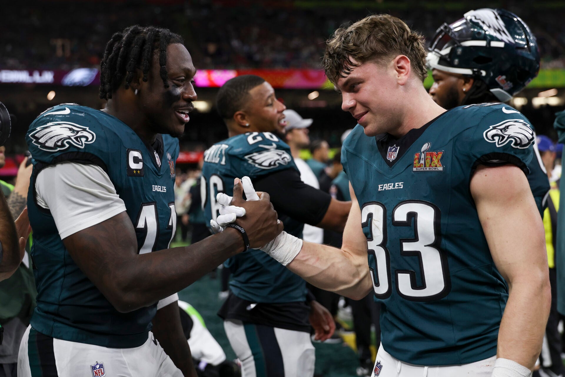NEW ORLEANS, LOUISIANA - FEBRUARY 09: A.J. Brown #11 and Cooper DeJean #33 of the Philadelphia Eagles react in the final minutes of Super Bowl LIX ...