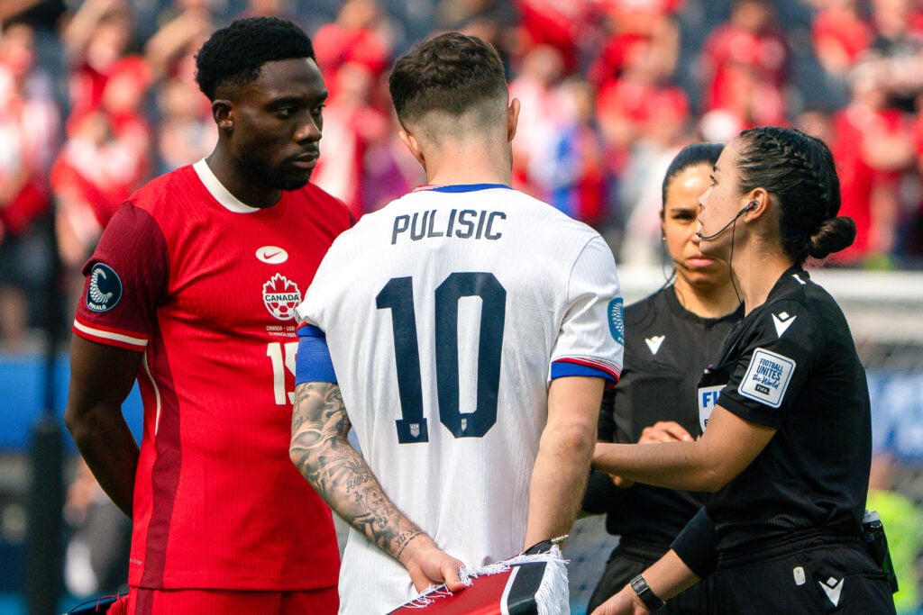 Alphonso Davies and Christian Pulisic meet before the United States v Canada third place match at the CONCACAF Nations League