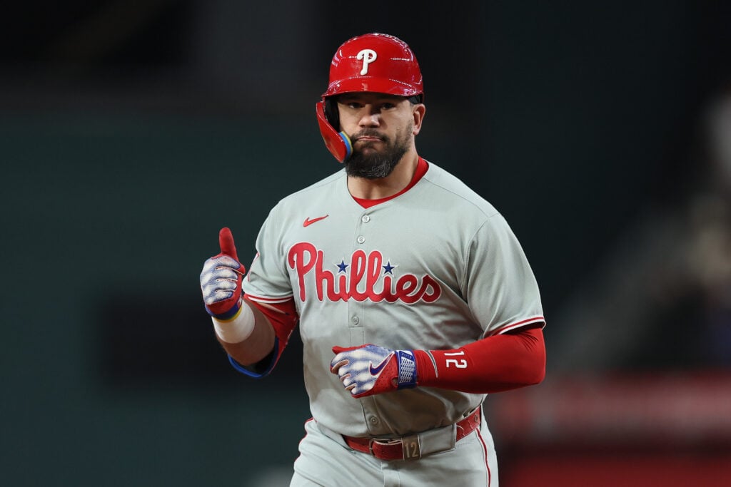 Kyle Schwarber #12 of the Philadelphia Phillies celebrates toward his dugout as he runs the bases on his first inning solo home run against the Texas Rangers at Globe Life Field on August 08, 2025 in Arlington, Texas.