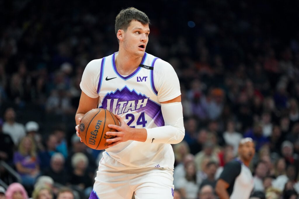 Walker Kessler #24 of the Utah Jazz handles the ball during the first half of the Emirates NBA Cup game against the Phoenix Suns at Mortgage Matchup Center