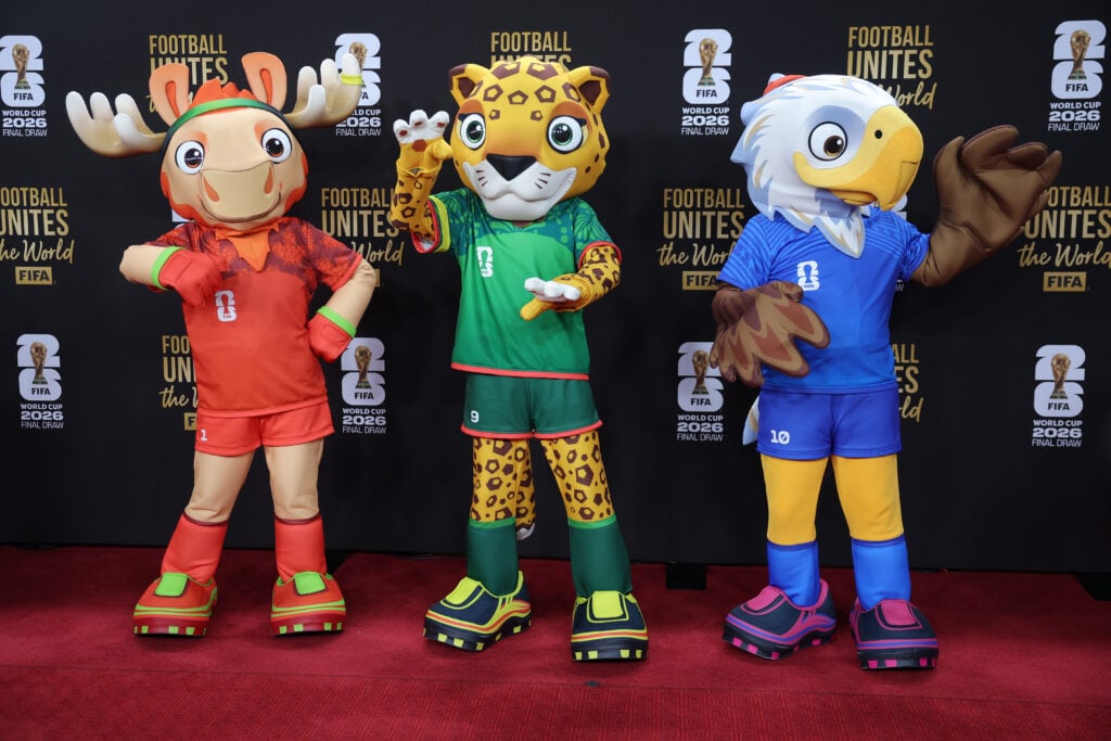 Official mascots Maple the Moose of Canada, Zayu the Jaguar of Mexico, and Clutch the Eagle of USA pose on the red carpet prior to the FIFA World Cup 2026 Official Draw at John F. Kennedy Center for the Performing Arts.