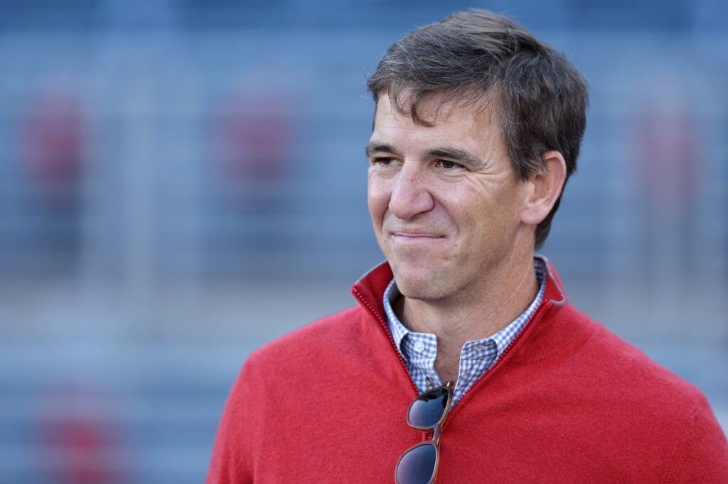 Eli Manning is seen on the sidelines prior to the game between the Tulane Green Wave and the Ole Miss Rebels during the 2025 College Football Playoff First Round Game at Vaught-Hemingway Stadium.