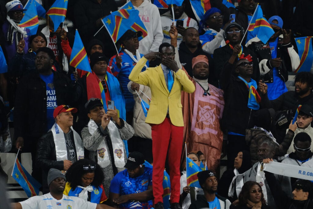 Congolese animator âLumumbaâ supports his team by standing throughout the match in Morocco