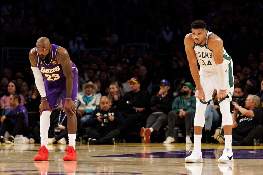 Los Angeles Lakers forward LeBron James (23) and Milwaukee Bucks forward Giannis Antetokounmpo (34) lean on their knees in the back court during a foul shot late in the game at Crypto.com Arena on January 9, 2026 in Los Angeles, California.