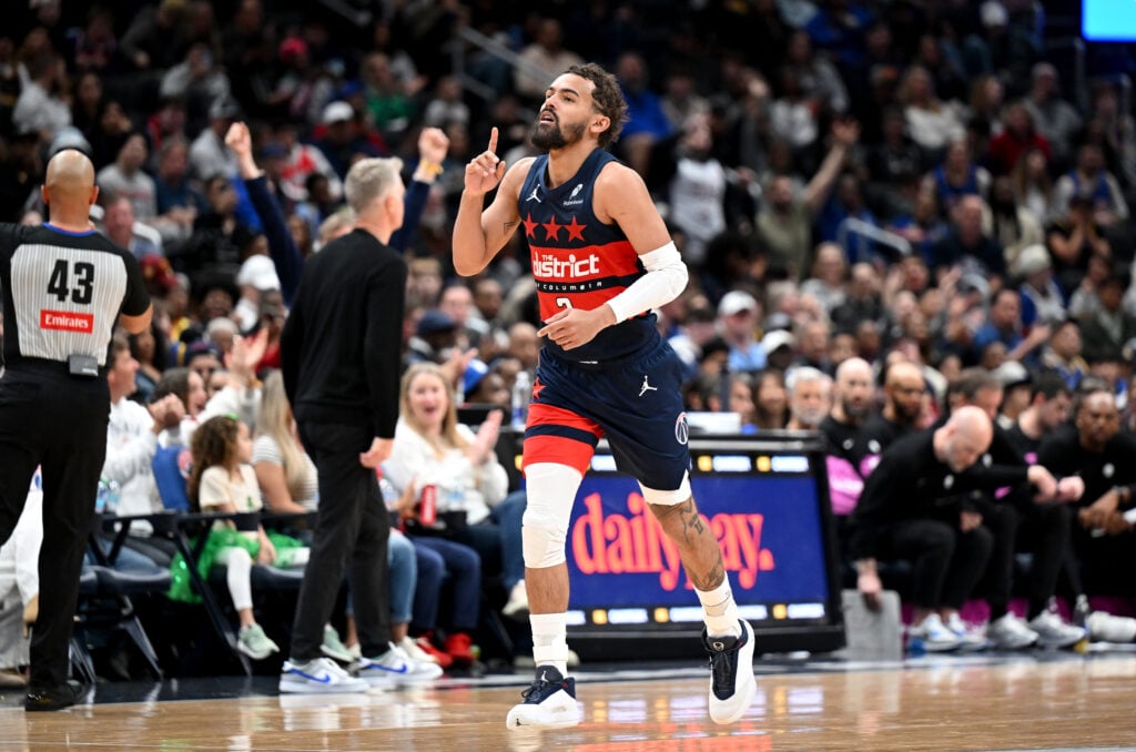 Trae Young #3 of the Washington Wizards celebrates during the game against the Golden State Warriors at Capital One Arena on March 16, 2026 in Washington, DC.