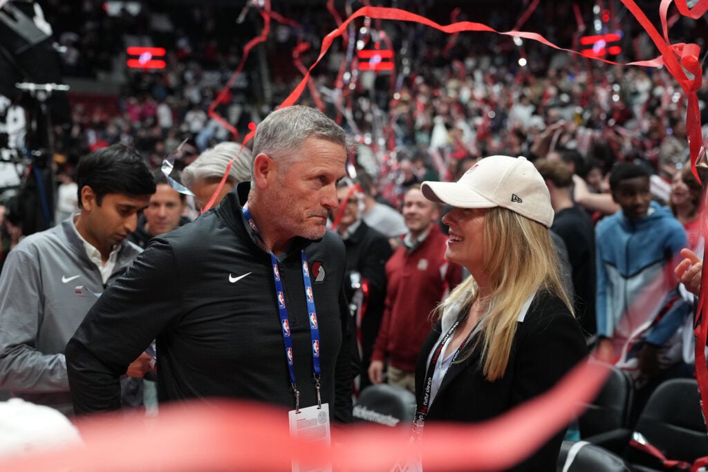 Owner Tom Dundon of the Portland Trail Blazers talks with his wife after the win against the New Orleans Pelicans at Moda Center.