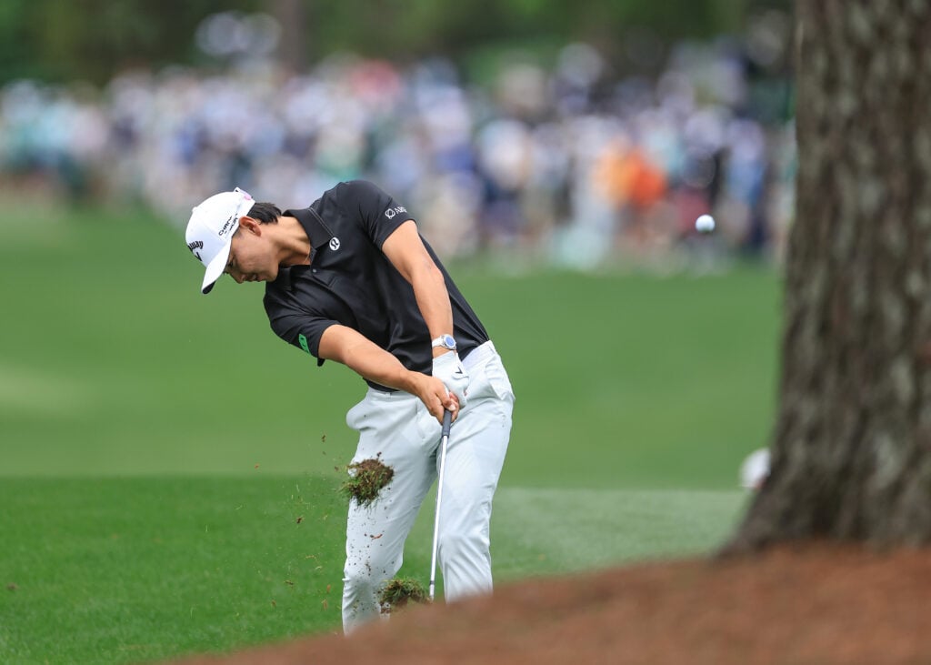 Min Woo Lee hits an approach shot in practice ahead of The Masters